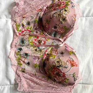 This is a gorgeous pink floral embroidery corset by Victoria Secret.